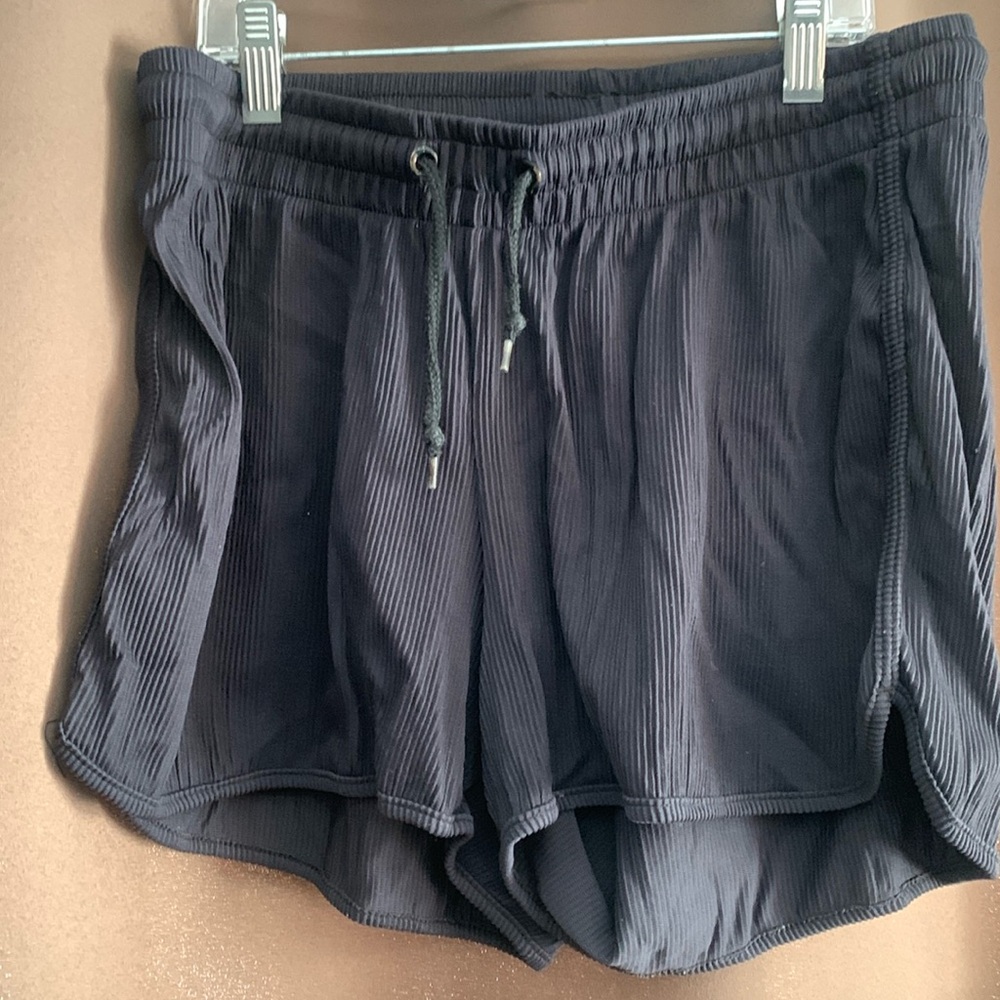 Black athletic shorts, size M, great for working out and playing sports